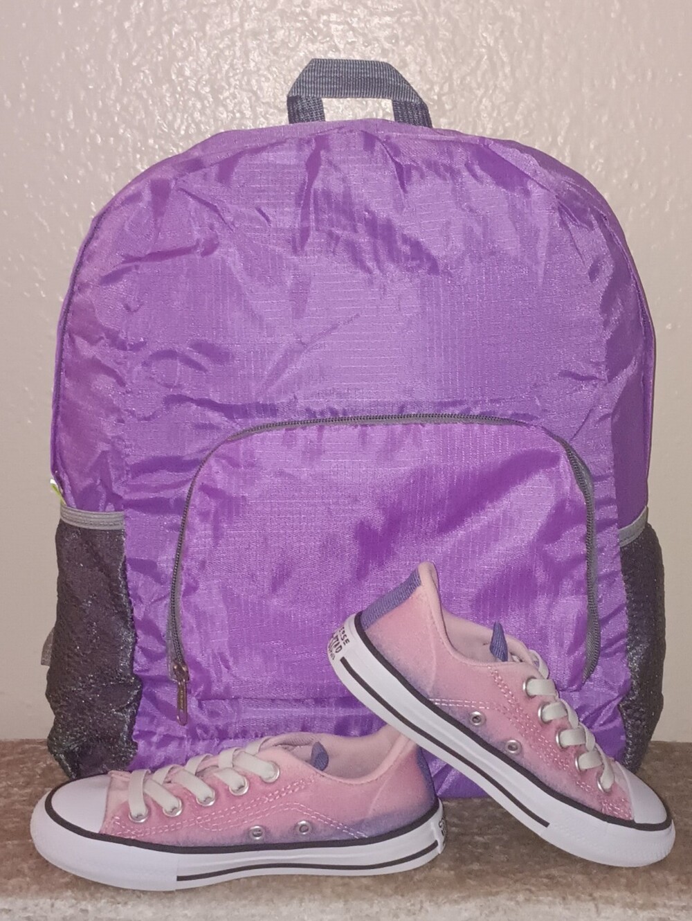 Converse All Star Pink/Purple sneakers with purple nylon 17-inch backpack.